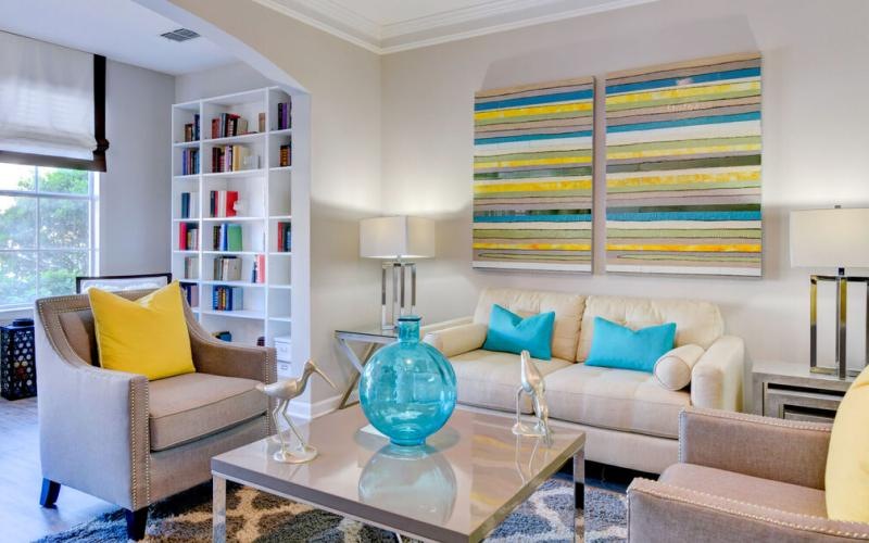 a living room with a white couch and a coffee table