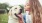 a person kissing a dog